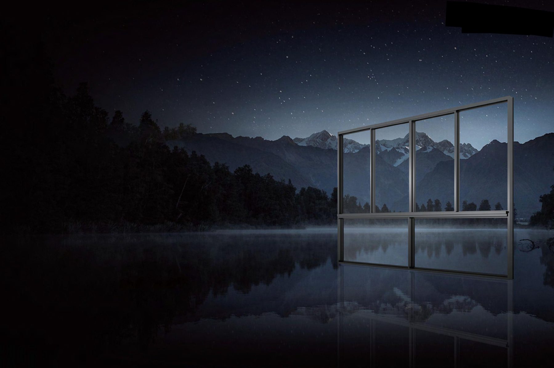 Glass pavilion at night with aluminum framing
