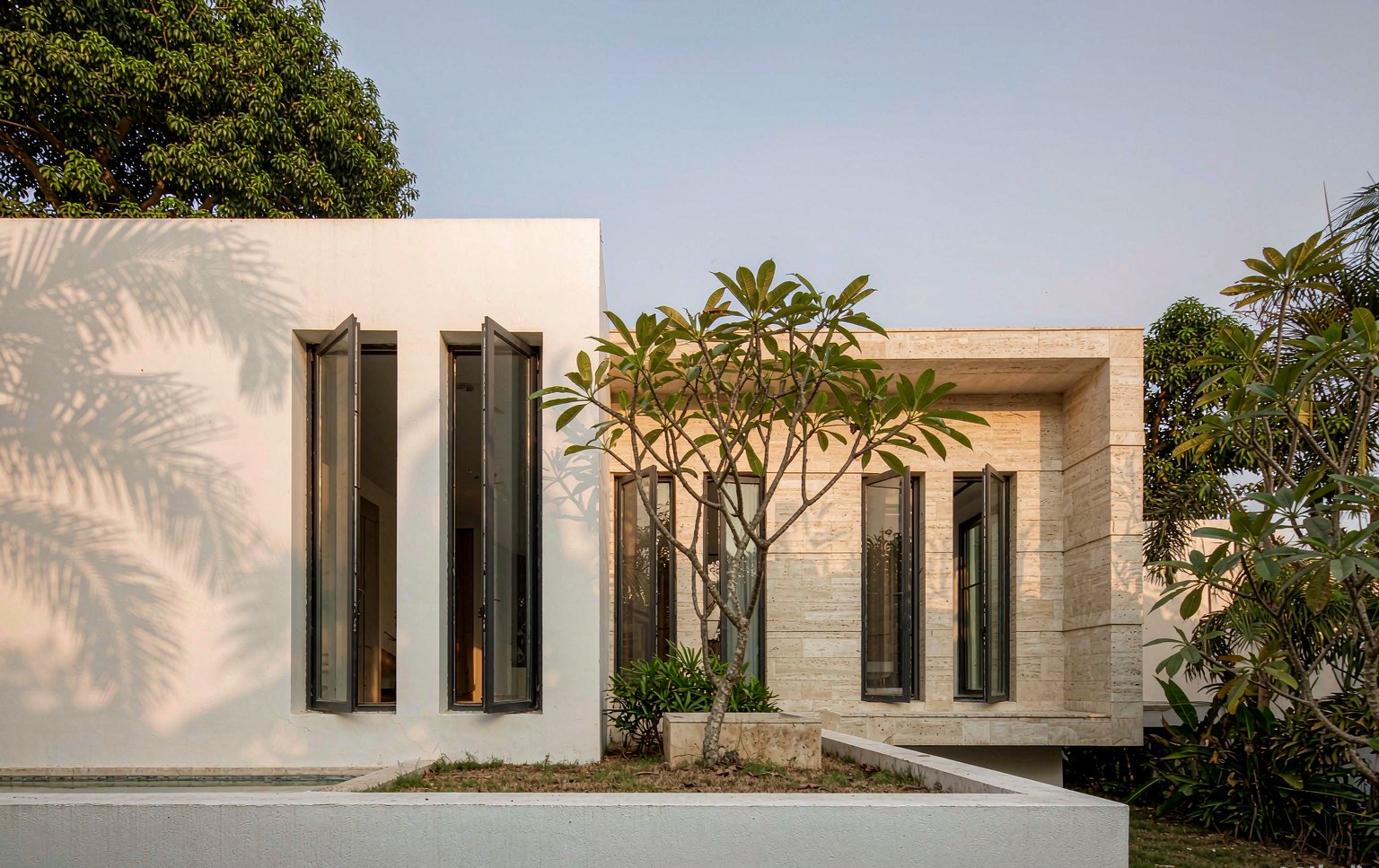 Villa facade with slim aluminum casement windows